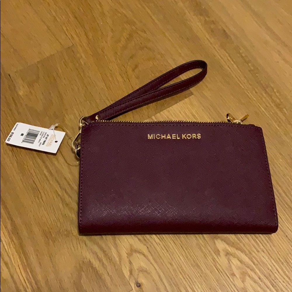 Michael Kors wristlet wallet with tags